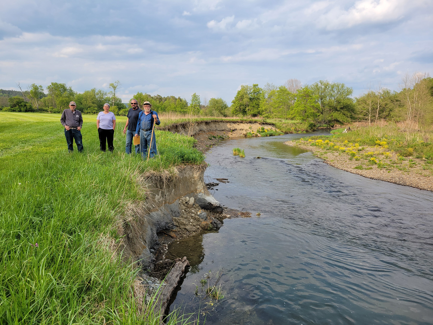 BVA members near the streambank erosion